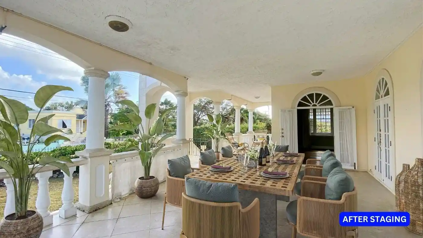 A house with a balcony, after staging with plants and a dining set ready for sale.
