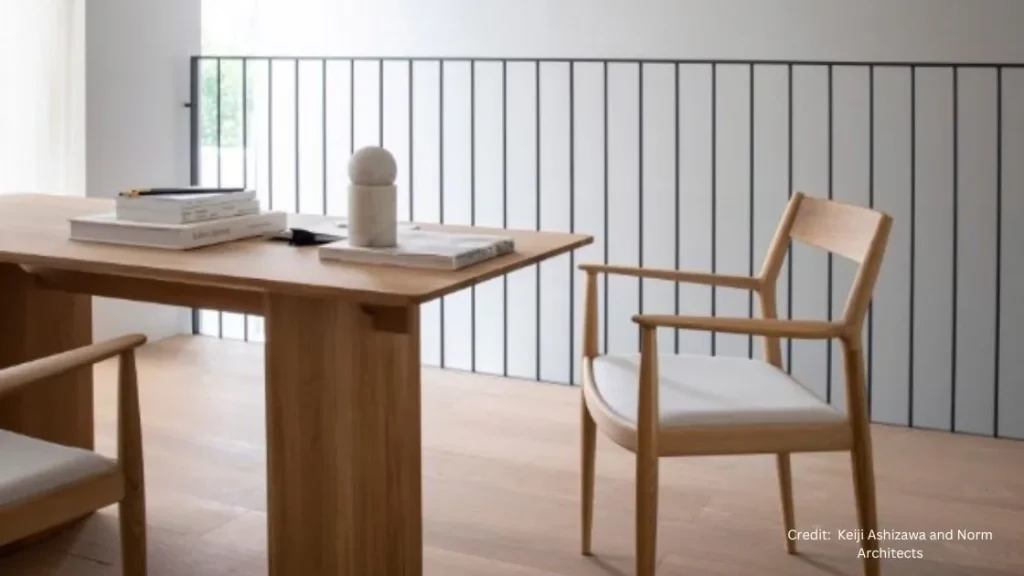 A Japandi style wooden table and chairs in a room.