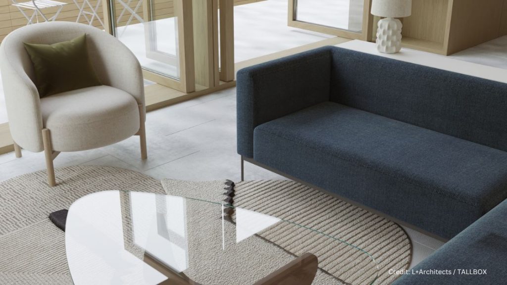 Embrace the philosophy of Wabi Sabi in your living room, featuring a serene blue couch and a minimalist glass table by tallbox and l+ architects wabi sabi team