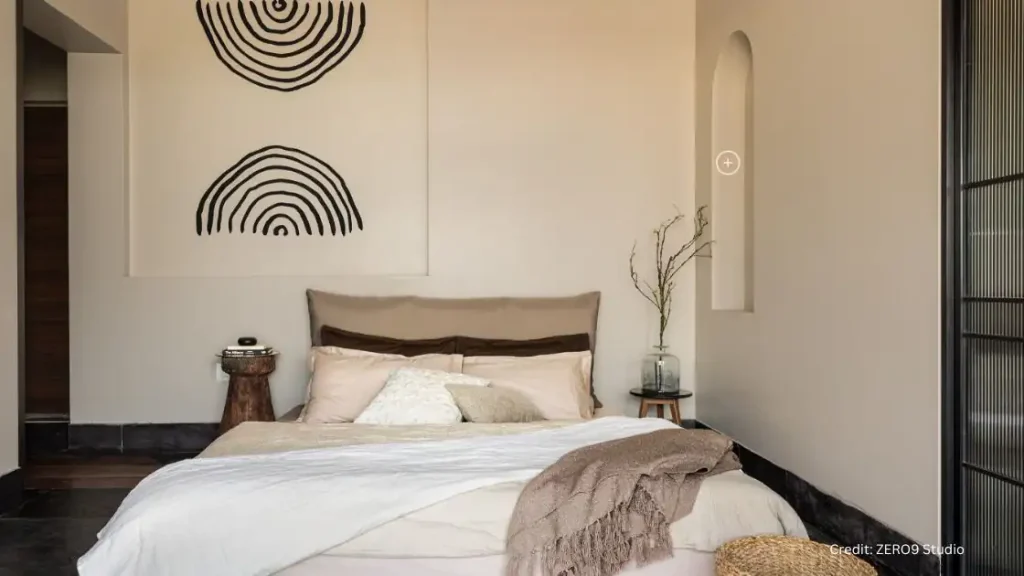 A Japandi-style bedroom with a bed and a bedside table.