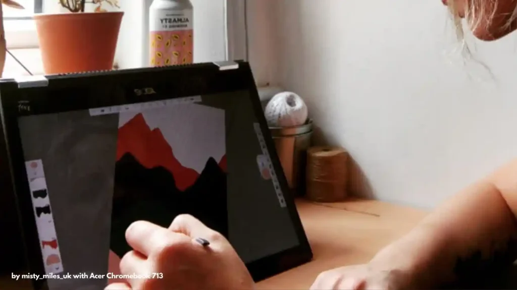 Person working on a digital art project on an Acer Chromebook Spin 714 with art supplies in the background.