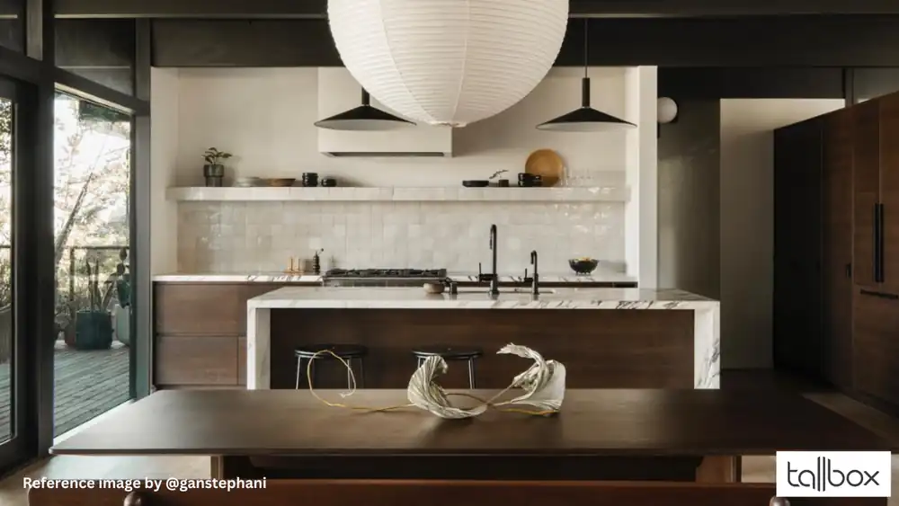Modern kitchen with dark wood cabinets, marble countertops, and a large white pendant light, perfect for showcasing your renovation project visualization.